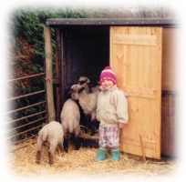 Jamie with the lambs at Last Cottage, 1990